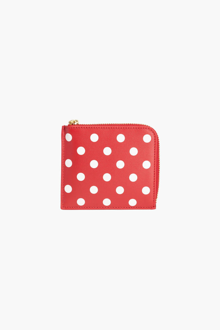 Portafoglio rosso a pois Comme des Garcons: accessorio elegante e resistente