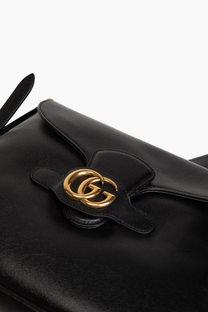 Borsa Gucci in pelle nera con iconico logo GG