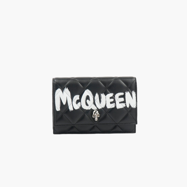 ALEXANDER MCQUEEN Portafoglio in pelle nera trapuntata con decorazione teschio - Made in Italy